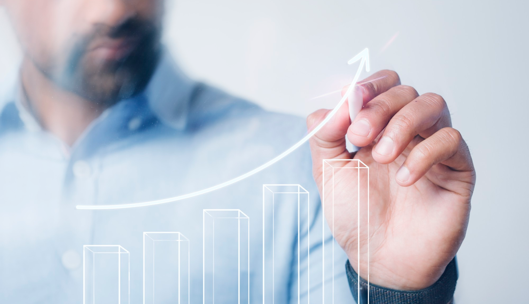 Businessman drawing growth chart to show how accessibility is important in web design for improving business performance.