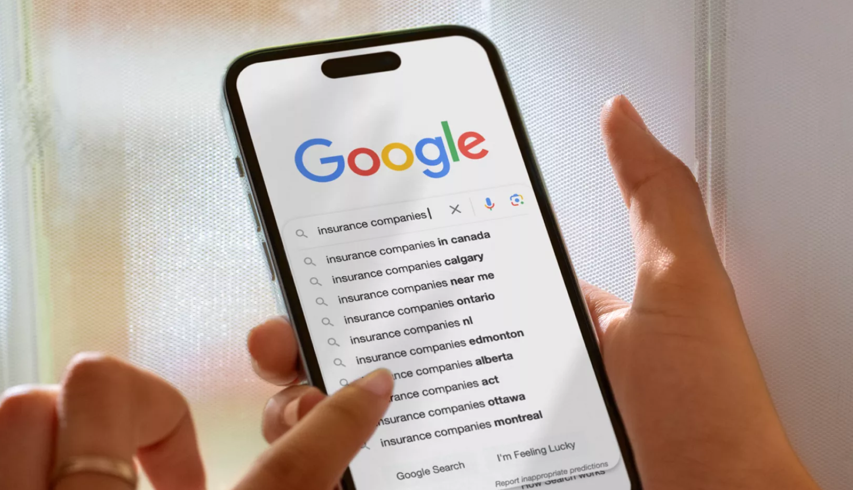 An image of a person searching on google about the Common Website Mistakes Insurance Companies Make