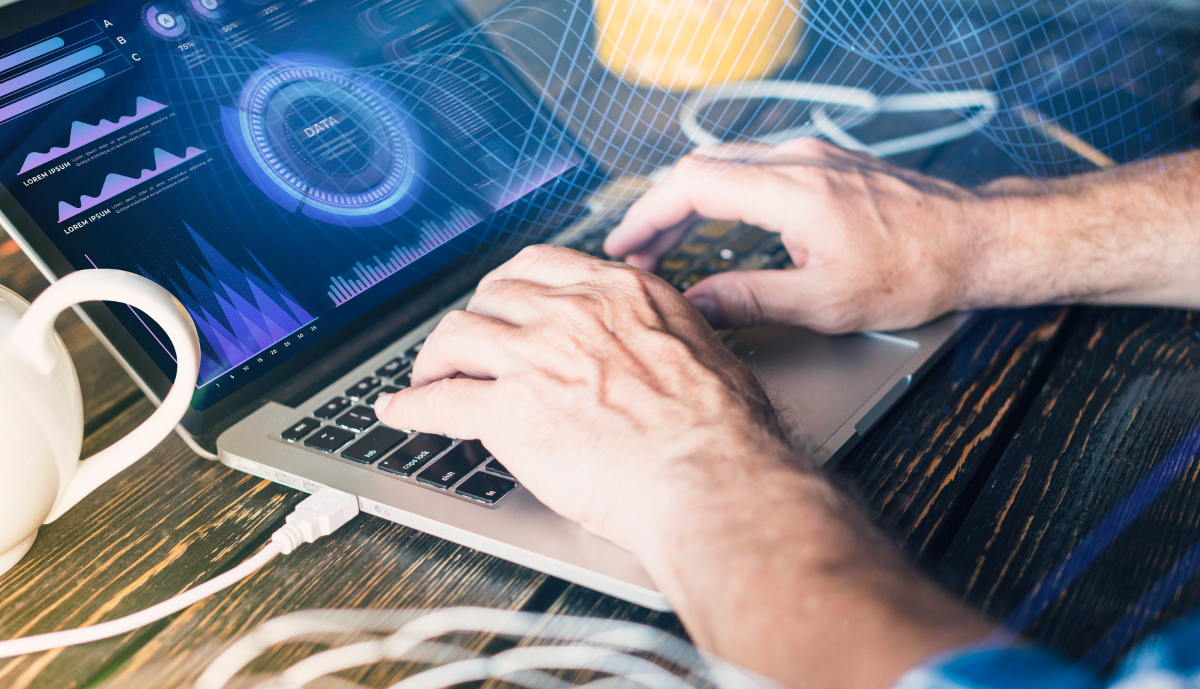 A person typing on a laptop displaying a graph related to application modernization.