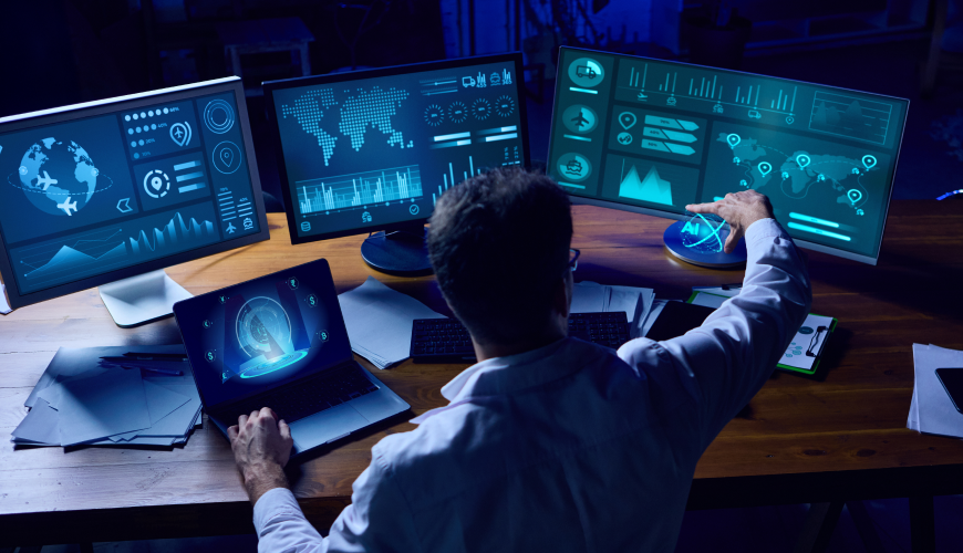 IT specialist analyzing dashboards for application performance monitoring (APM) across multiple systems and global infrastructure.