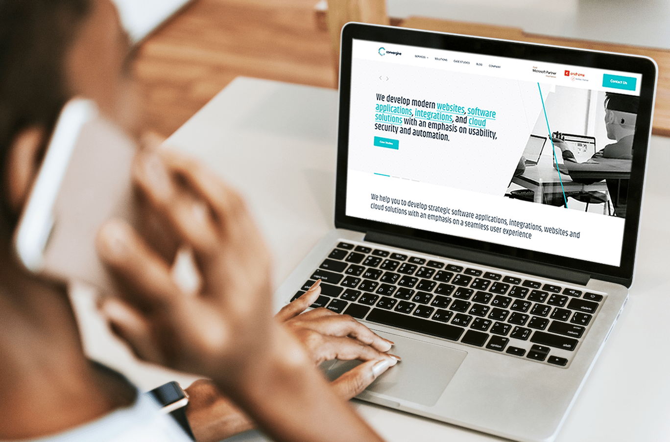 A woman engaged with her laptop, exploring a website that highlights the importance of good web design.